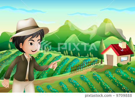 A boy pointing at the barnhouse at the farm 9709888
