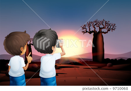 Two boys taking photos at the desert Two boys taking photos at the desert 9710068