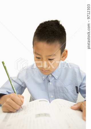 A boy studying 9712303