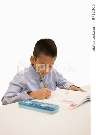 A boy studying A boy studying 9712306