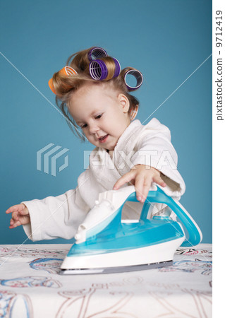 cute little housewife with iron cute little housewife with iron 9712419