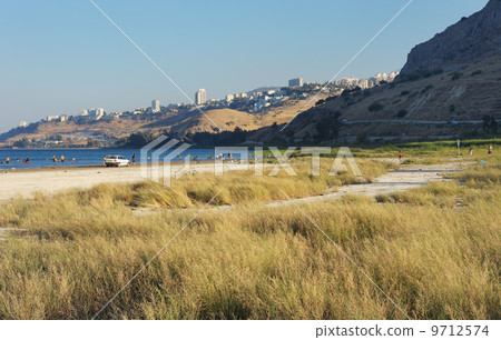 The shore of lake Kinneret in the evening The shore of lake Kinneret in the evening 9712574