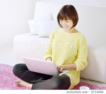 Woman using a laptop Woman using a laptop 9718980