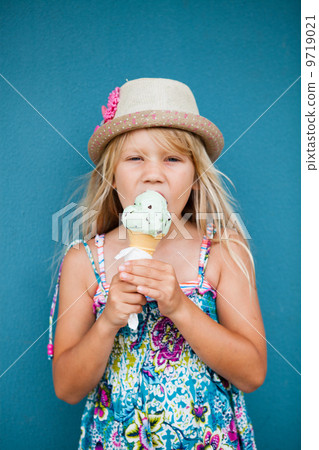 Young girl eating ice cream Young girl eating ice cream 9719021