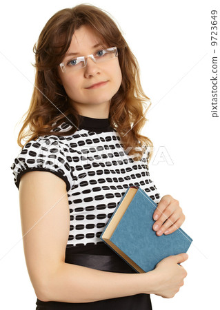 Young woman - teacher with a book Young woman - teacher with a book 9723649