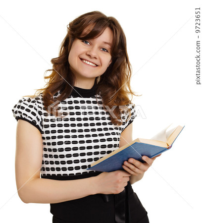 Smiling girl with a book isolated on white 9723651