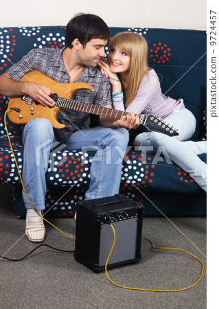 Romantic couple with electric guitar Romantic couple with electric guitar 9724457