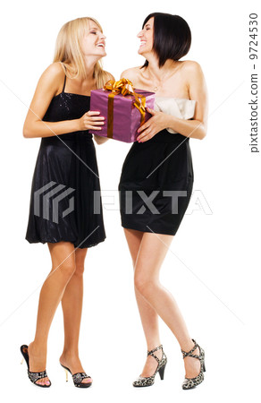 Pretty festive girls with a gift box 9724530