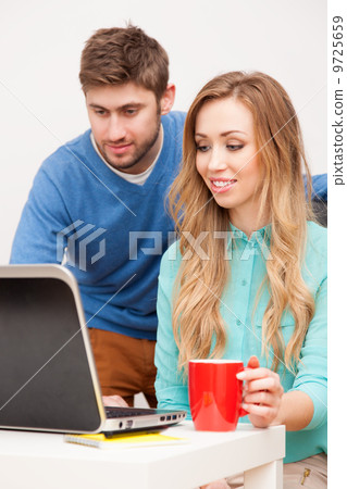 Young couple working with laptop Young couple working with laptop 9725659