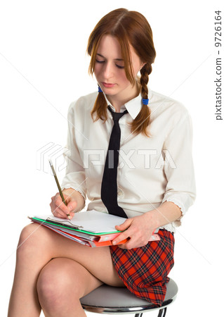 Beautiful lady writing on a worksheet 9726164