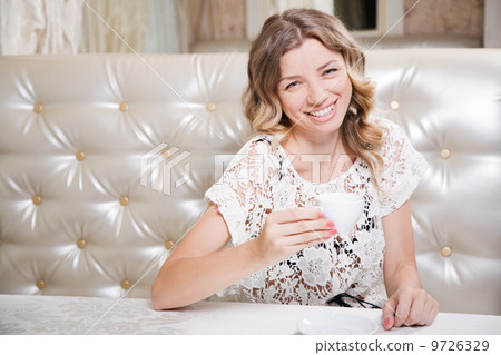 Beautiful lady in a restaurant Beautiful lady in a restaurant 9726329