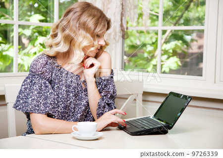 Beautiful lady in a restaurant Beautiful lady in a restaurant 9726339