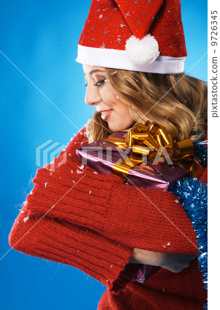 Lovely girl with Christmas gift 9726345