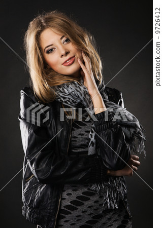 Pretty elegant woman in black leather jacket 9726412