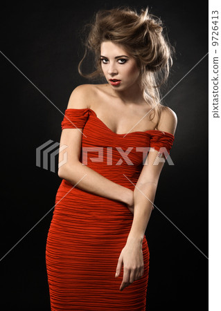 Gorgeous woman in a red dress Gorgeous woman in a red dress 9726413