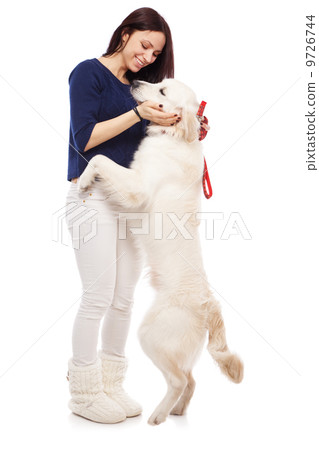 Beautiful young woman with a dog 9726744