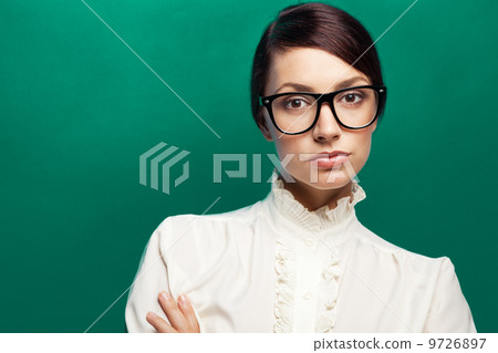 Strict woman in large glasses 9726897