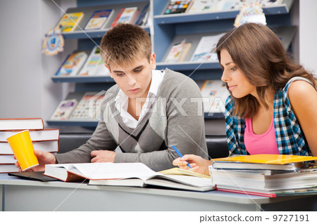 Students in a library 9727191