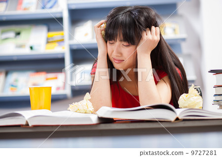 Beautiful female stressed student Beautiful female stressed student 9727281