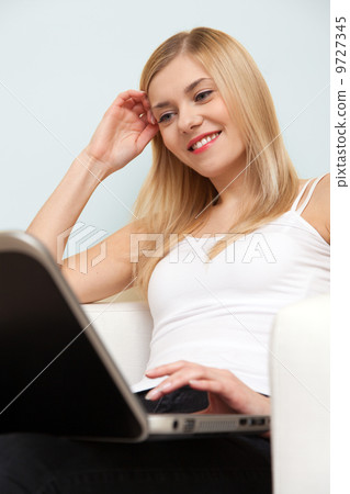 Young woman with a laptop Young woman with a laptop 9727345