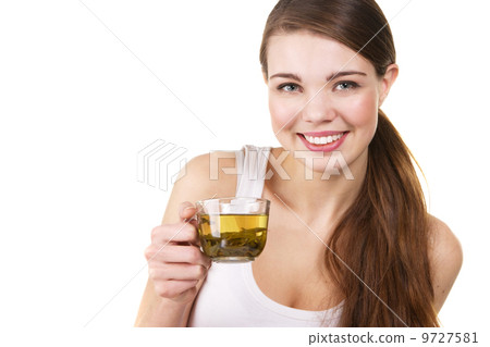 Young beautiful woman with a cup of tea Young beautiful woman with a cup of tea 9727581