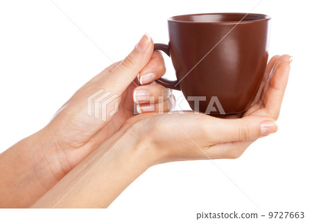 Female hand holding a cup Female hand holding a cup 9727663