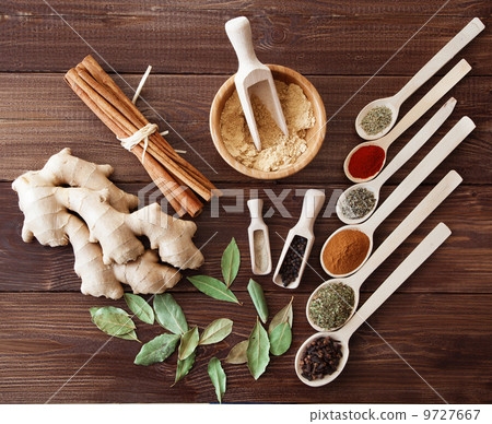 Spice assortment on a wooden table Spice assortment on a wooden table 9727667