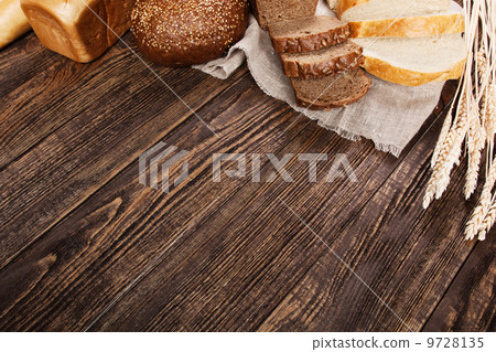 Bread assortment on a wooden table Bread assortment on a wooden table 9728135
