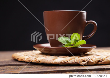 Tea with mint on a wooden table Tea with mint on a wooden table 9728341