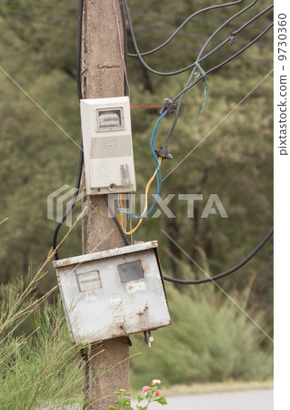 Cabinet with electrical meter on a concrete pole 9730360