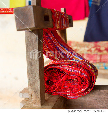 Handmade silk textile industry, silk scarf on a old machine Handmade silk textile industry, silk scarf on a old machine 9730466