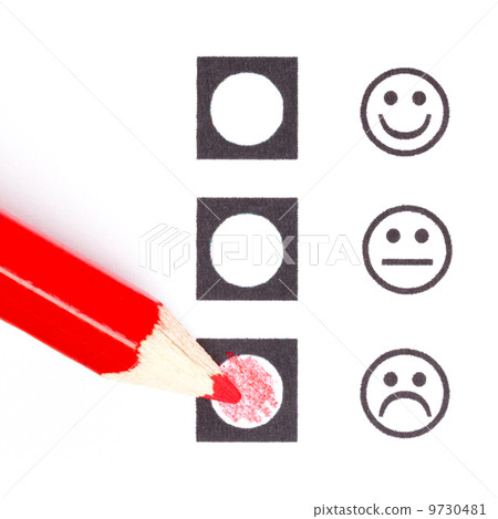 Red pencil choosing the right smiley Red pencil choosing the right smiley 9730481