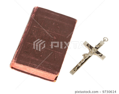 Old antique bible and cross on a white background 9730614