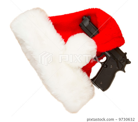 Weapon (firearm) concealed in santas hat Weapon (firearm) concealed in santas hat 9730632