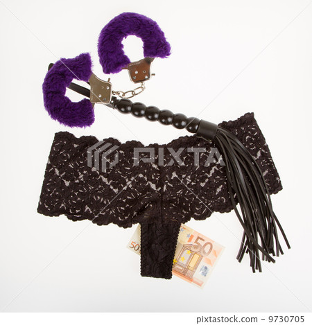 Fluffy purple handcuffs, a whip, money and panties, prostitution 9730705