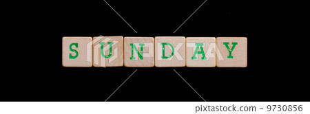 Sunday spelled out in old wooden blocks Sunday spelled out in old wooden blocks 9730856