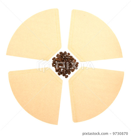 Coffee beans on a coffee filter (white background) Coffee beans on a coffee filter (white background) 9730870