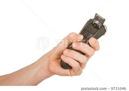 Hand holding an electric shaver Hand holding an electric shaver 9731046