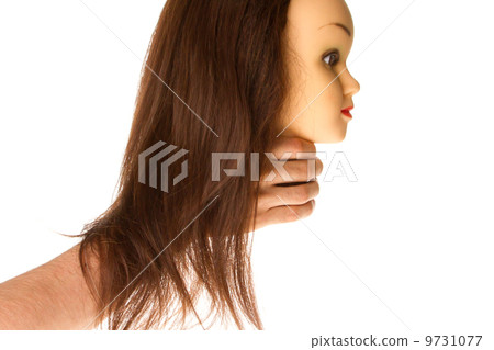 Hand holding a puppet (hair styling) 9731077