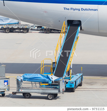 AMSTERDAM - SEPTEMBER 6: KLM plane is being loaded at Schiphol A 9731115