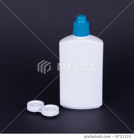 Lens casing and bottle of water isolated on black Lens casing and bottle of water isolated on black 9731133