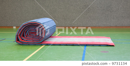 Very old long mat on a green court Very old long mat on a green court 9731134