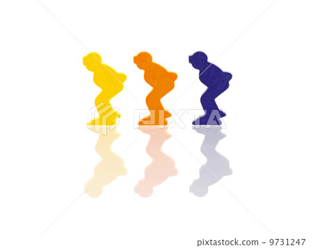 Three colored pawns isolated on a white background 9731247