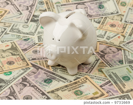 Piggy bank on dollar bills Piggy bank on dollar bills 9731669