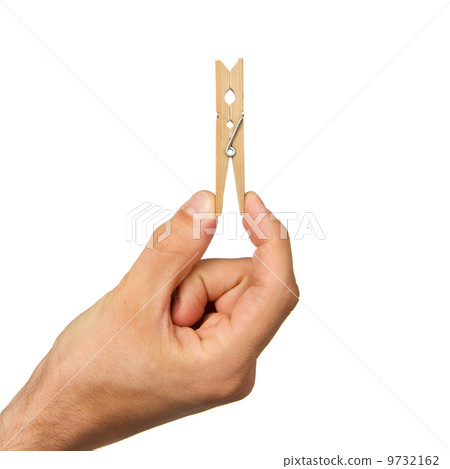 Hand holding clothes peg Hand holding clothes peg 9732162