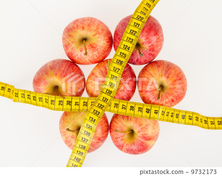 Red apples with a yellow tape-measure Red apples with a yellow tape-measure 9732173