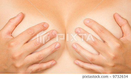Hands covering breasts 9732634