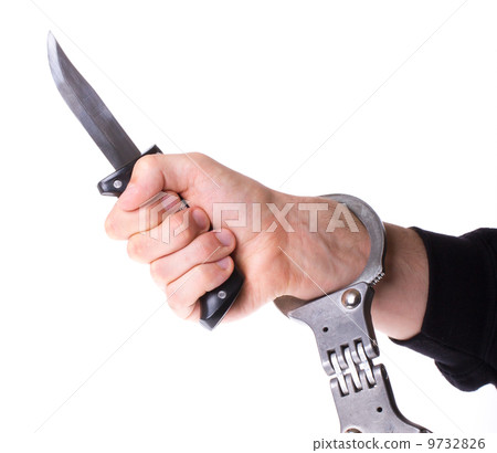 Male with a sharp knife in it's hand with a handcuff 9732826