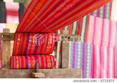 Handmade silk textile industry, silk scarf on a old machine Handmade silk textile industry, silk scarf on a old machine 9732975