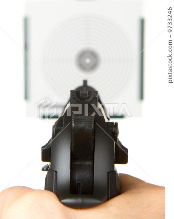 Handgun aimed on a shooting target 9733246